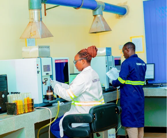 Njema Labs laboratory professionals operating analytical equipment